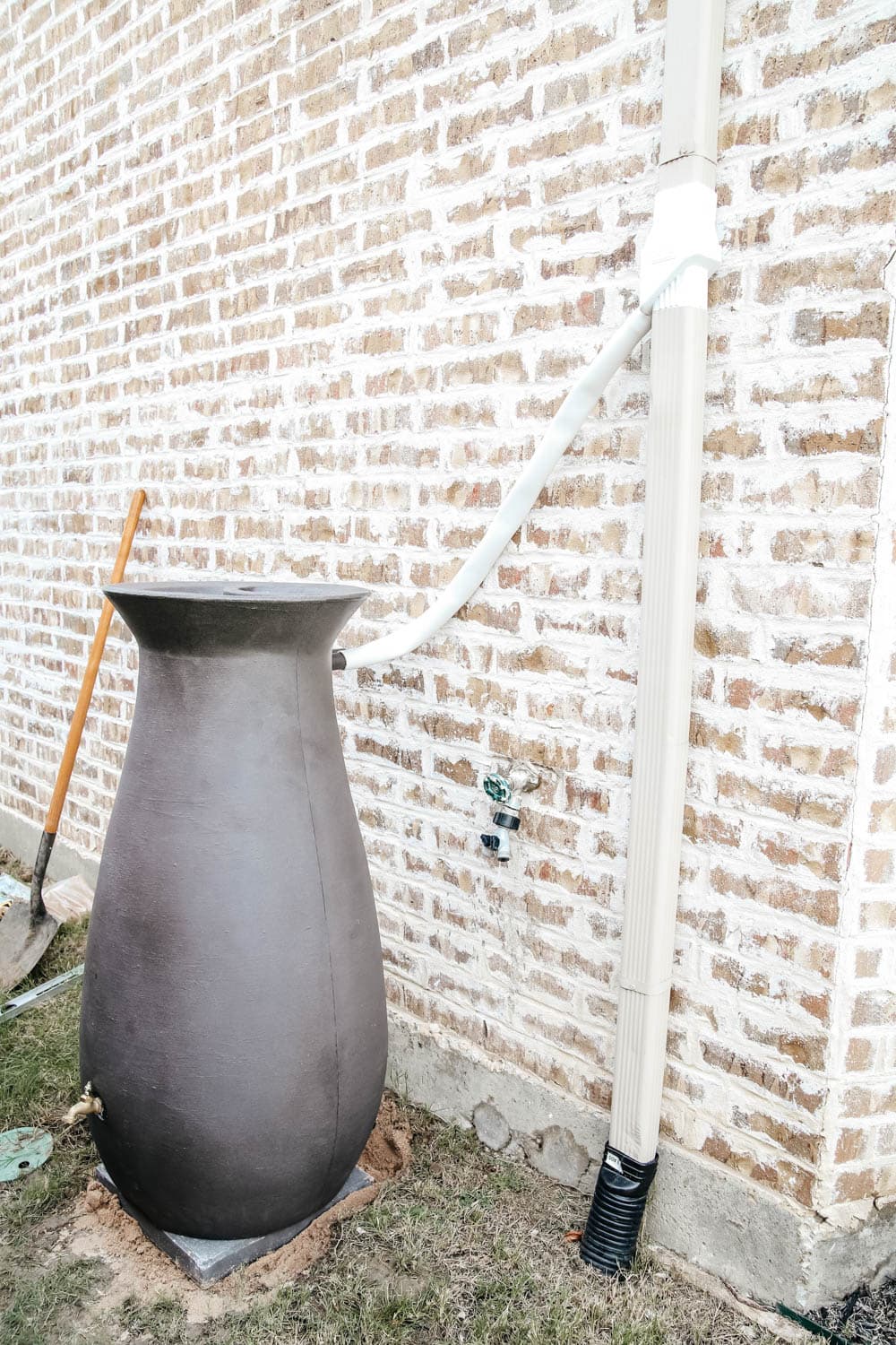 Install a rain barrel system for your home and save money and conserve your water supply. Simple step-by-step tutorial for installing a rain barrel. #ABlissfulNest