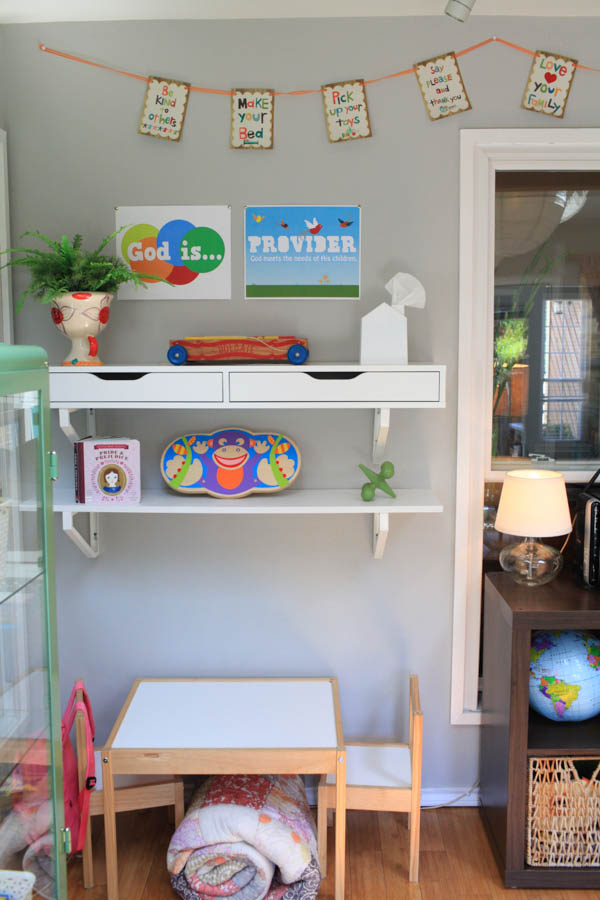 kids table with shelves on the wall