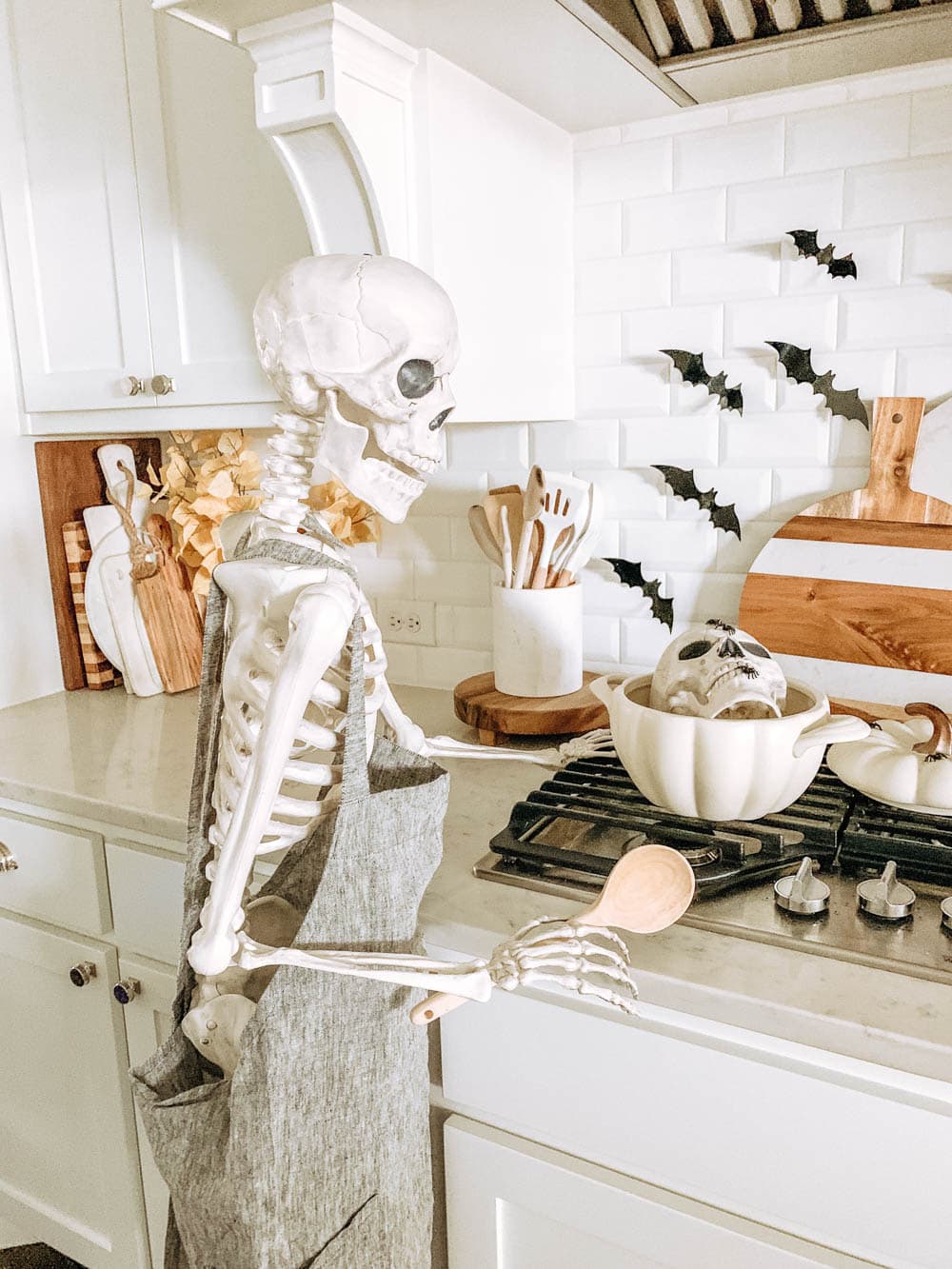 Posable skeleton cooking in a kitchen. Halloween decor ideas. #ABlissfulNest #halloween #halloweendecor