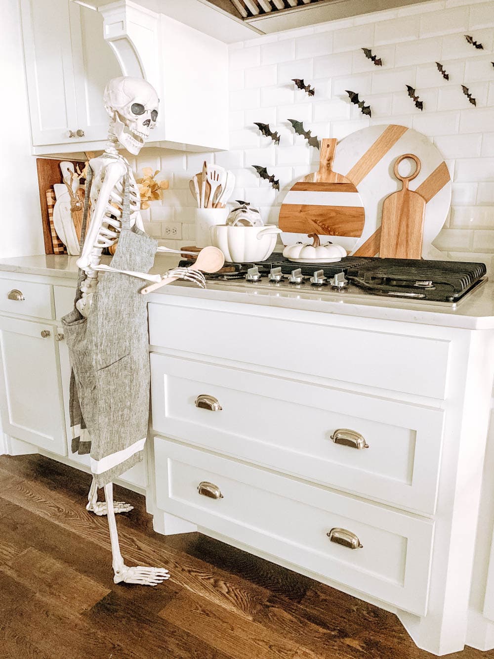 Posable skeleton cooking in a kitchen. Halloween decor ideas. #ABlissfulNest #halloween #halloweendecor