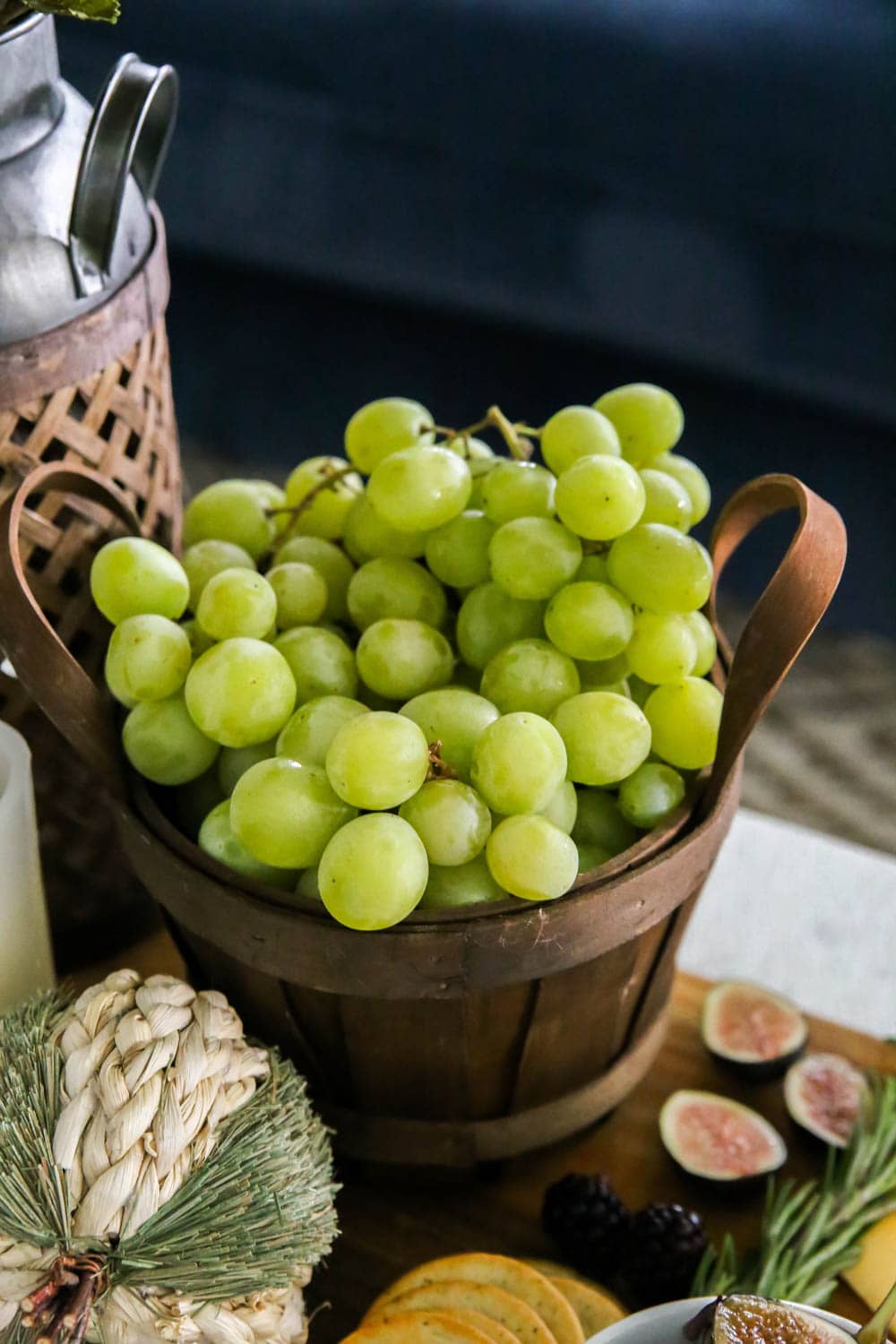 Use baskets to group fruit on a harvest charcuterie board. #ABlissfulNest #fall #ad #RothCheese