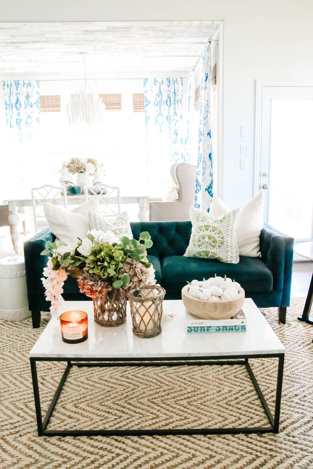 Subtle fall decor accents, blue sofa, marble and iron coffee table, living room. #ABlissfulNest #falldecor #livingroom