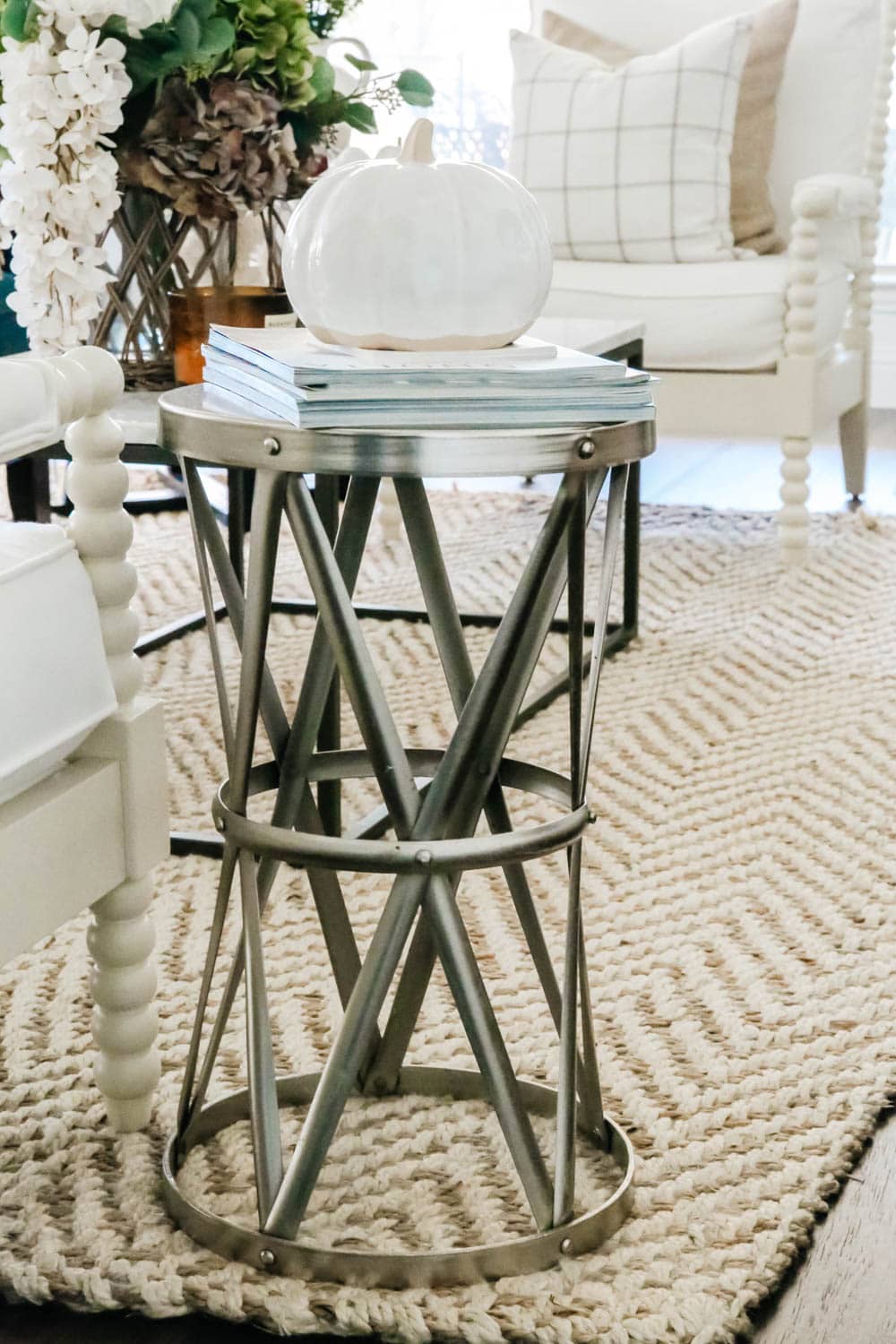 Stacked magazines, side table, pumpkin, fall decor. #ABlissfulNest #falldecor #pumpkin