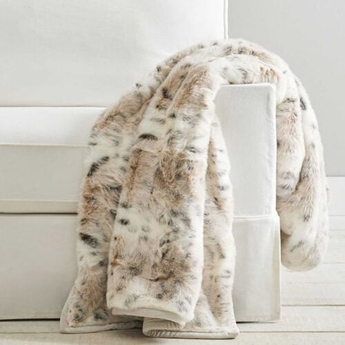 This faux fur snow leopard throw blanket looks so cozy! #ABlissfulNest