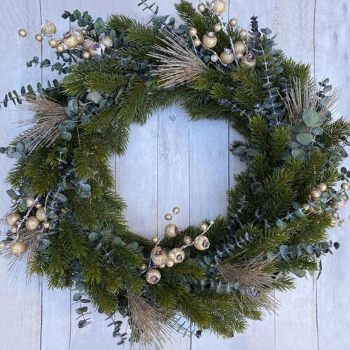 This pine wreath with gold accents is a perfect holiday and winter wreath for your front door! #ABlissfulNest