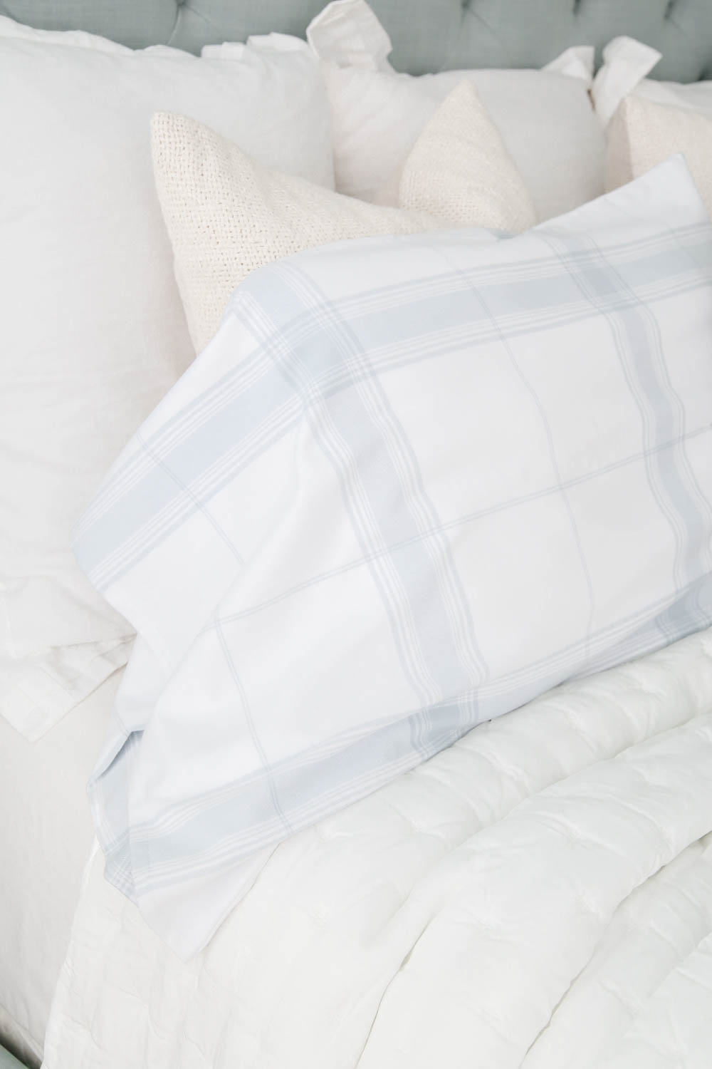 Layers of pillows in soft flannel material make a cozy bed for the season. #ABlissfulNest #bedroomdecor #bedroom