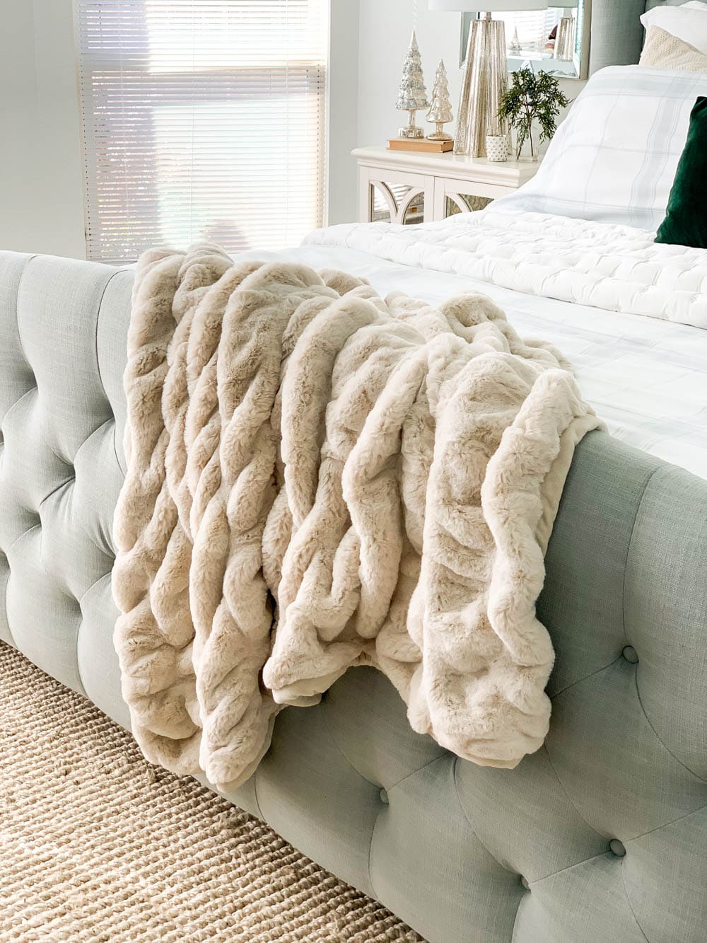 Add cozy warm fur blankets to your bedroom for the holiday season. #ABlissfulNest #christmasbedroom #bedroomdecor