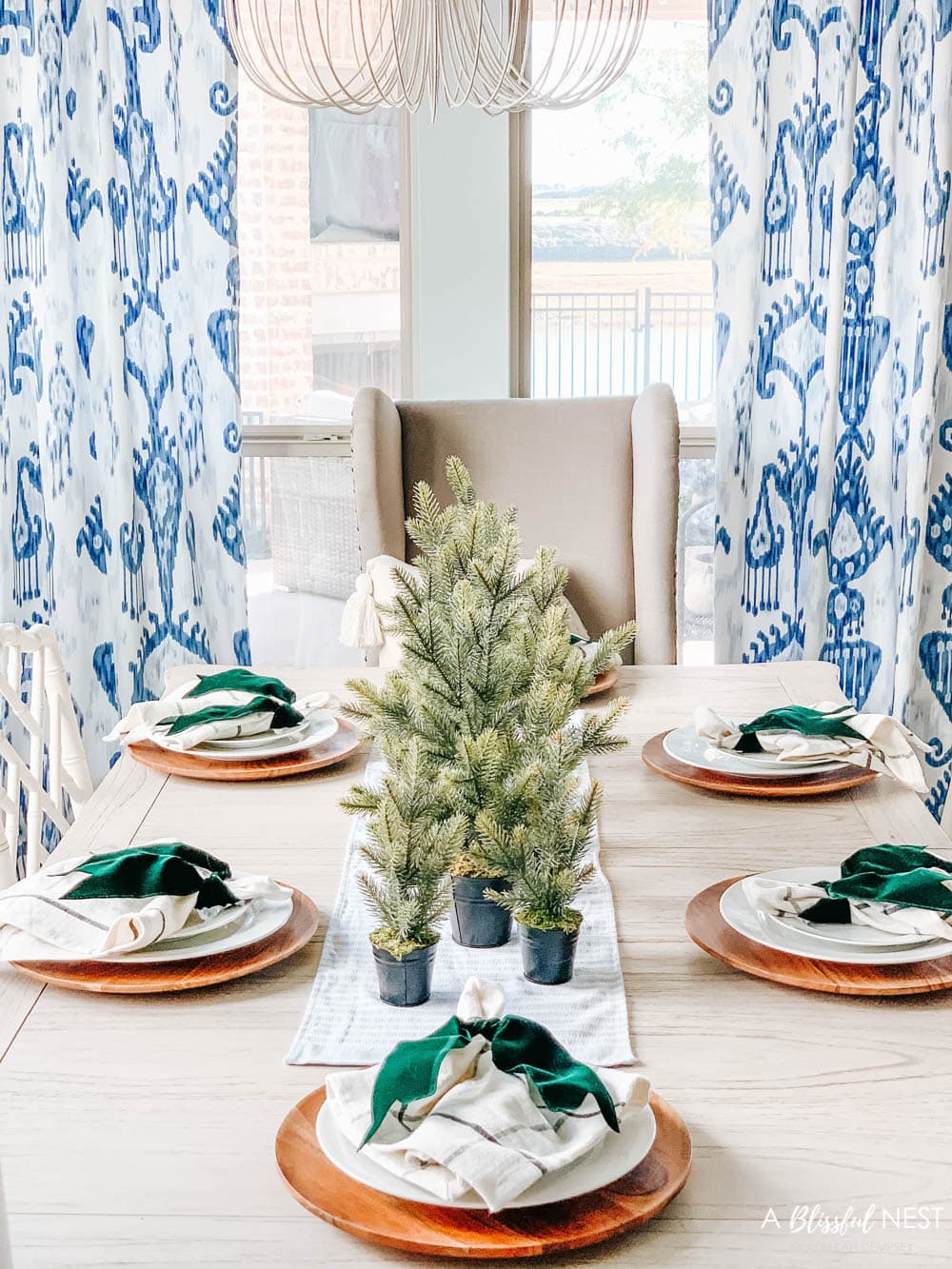 Blue and white dining room with Christmas decor. #ABlissfulNest #christmasdecor #diningroom