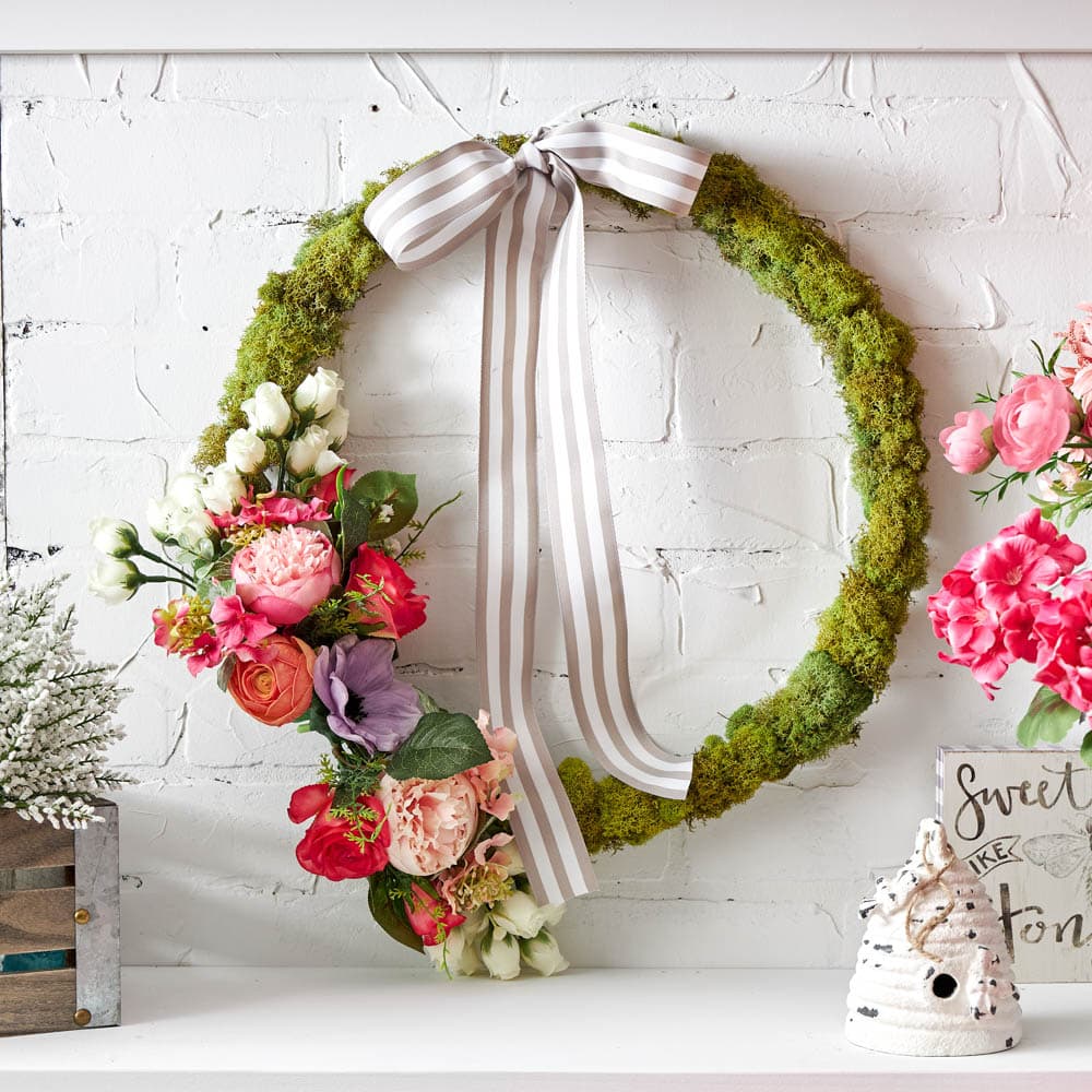 Bring new life to your front porch with this floral moss wreath for spring using materials all found at @Michaelsstores. #ABlissfulNest #MakeItWithMichaels #ad #springwreath