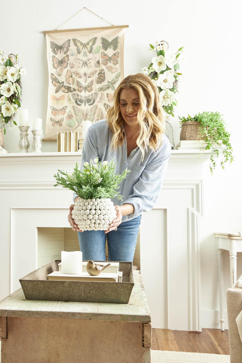 diy center pieces with fake flowers in styrofoam balls. Glue it to a vase!