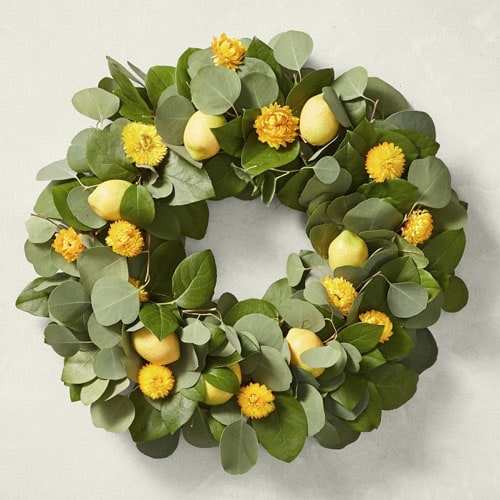 This bright lemon wreath is perfect for your front door this spring! #ABlissfulNest