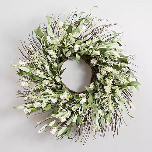 This gorgeous white wildflower wreath is a stunner for your front door! #ABlissfulNest