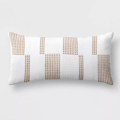 This woven lumbar pillow is such a fun, neutral piece to add to your patio this spring! #ABlissfulNest