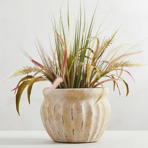 This weathered terra cotta planter is so pretty for your porch or patio this season! #ABlissfulNest