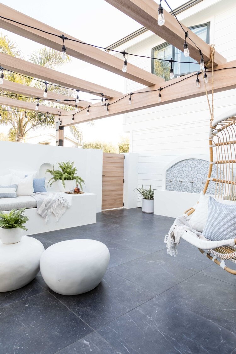 This outdoor living space designed by Pure Salt Interiors is such a dreamy space to spend the summer!