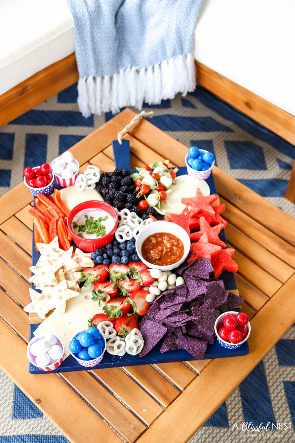 A beautiful patriotic charcuterie board with something for everyone. #ABlissfulNest #charcuterieboard #4thofjuly