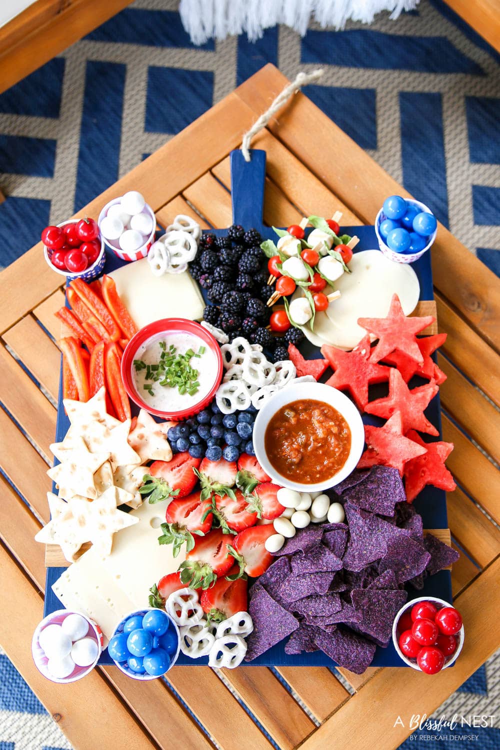 A beautiful patriotic charcuterie board with something for everyone. #ABlissfulNest #charcuterieboard #4thofjuly