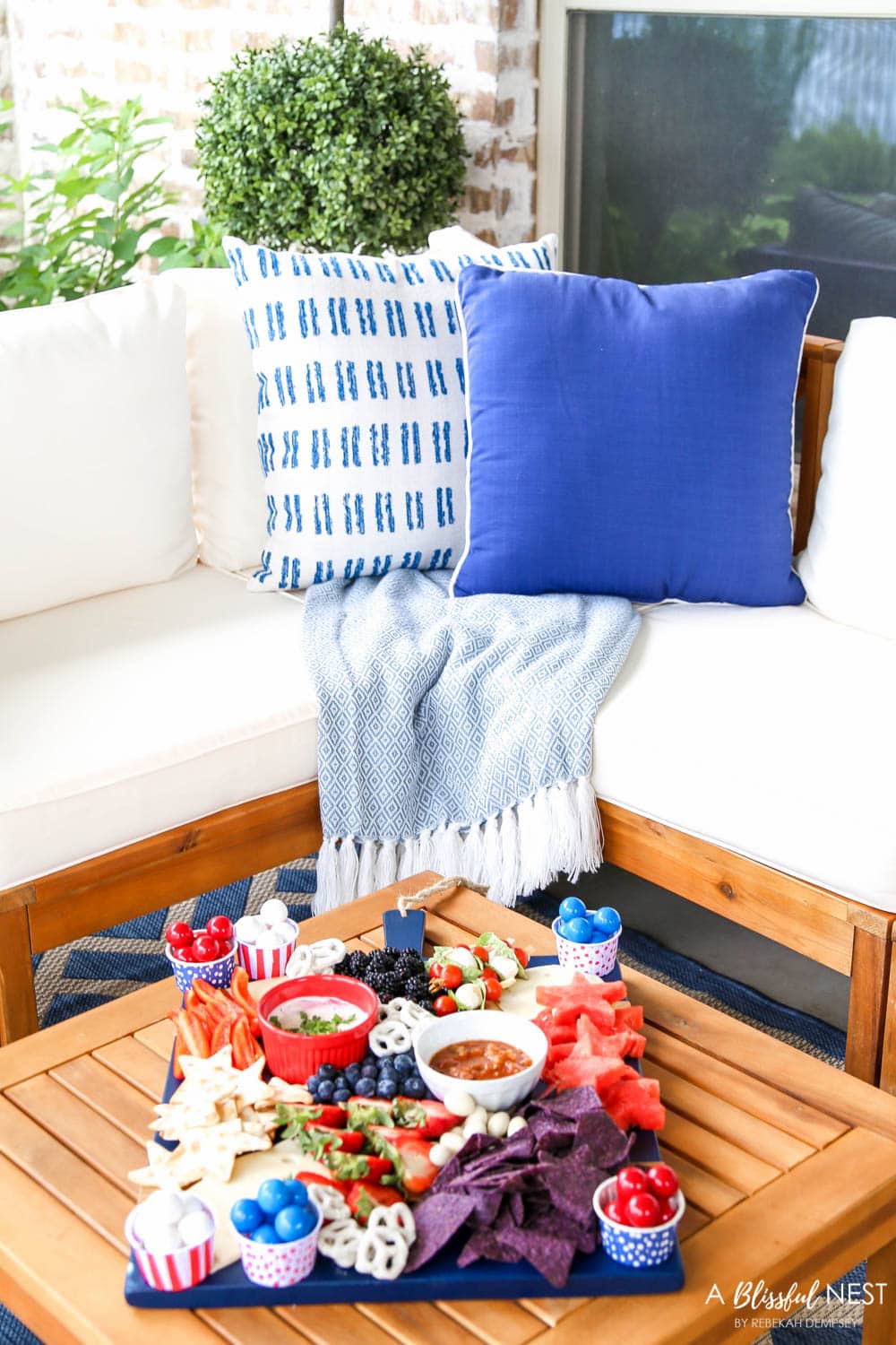 A beautiful patriotic charcuterie board with something for everyone. #ABlissfulNest #charcuterieboard #4thofjuly