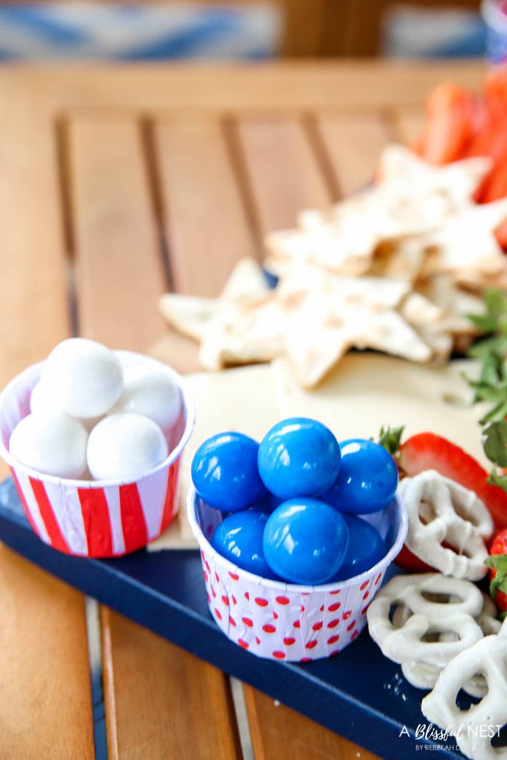 A beautiful patriotic charcuterie board with something for everyone. #ABlissfulNest #charcuterieboard #4thofjuly