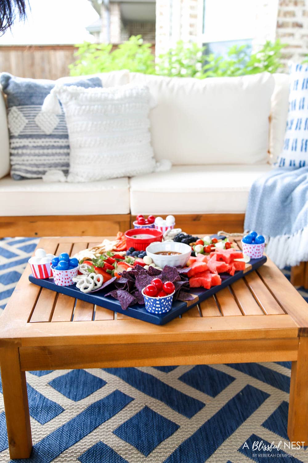 A beautiful patriotic charcuterie board with something for everyone. #ABlissfulNest #charcuterieboard #4thofjuly