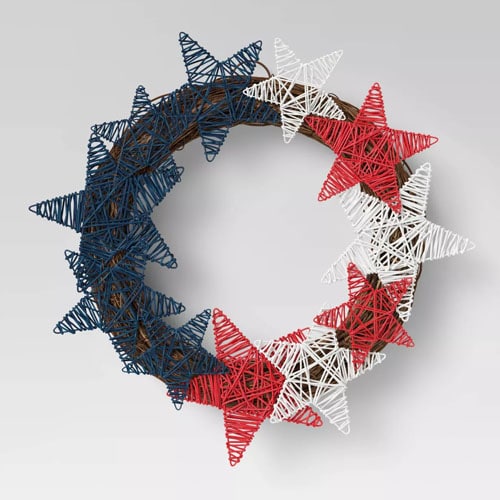 This woven star wreath is only $15 and a perfect 4th of July piece of decor to add to your patio! #ABlissfulNest