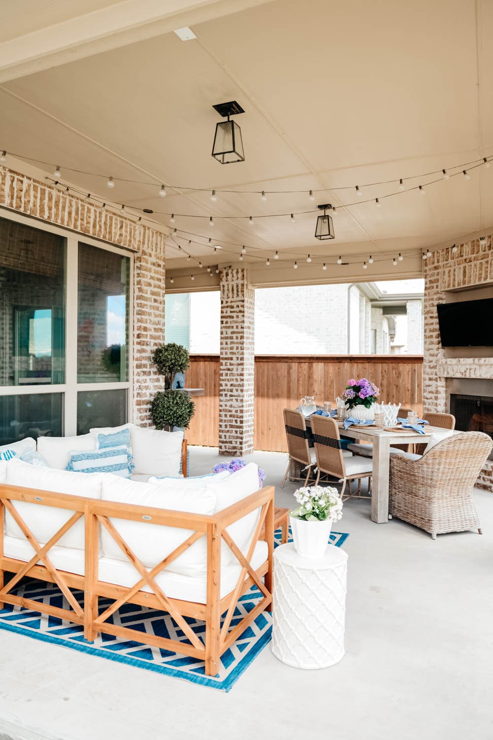 Summer patio sectional, outdoor table, outdoor television, outdoor seating ideas. #ABlissfulNest #summerpatio #patiodecor