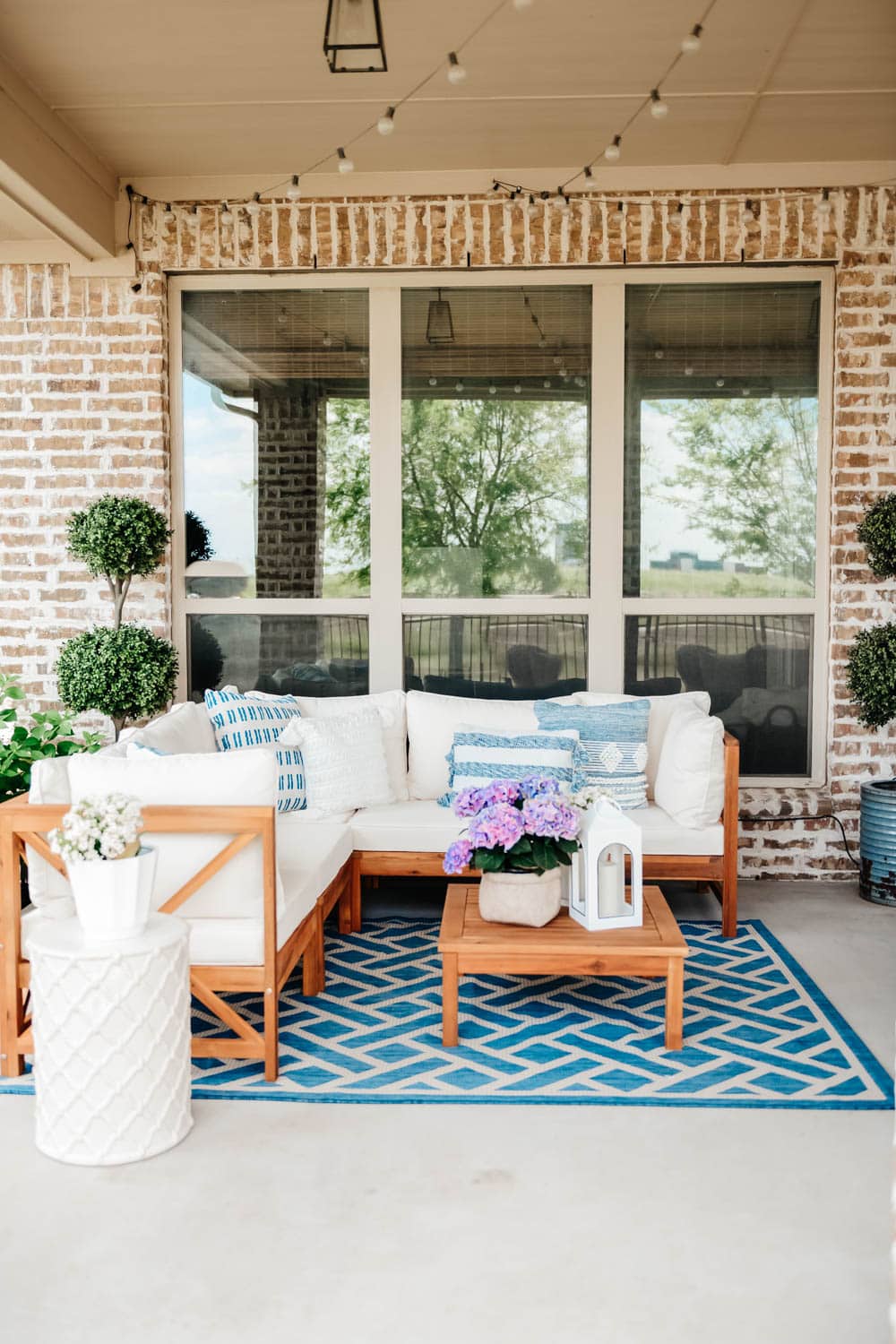 Summer patio sectional, outdoor table, outdoor television, outdoor seating ideas. #ABlissfulNest #summerpatio #patiodecor