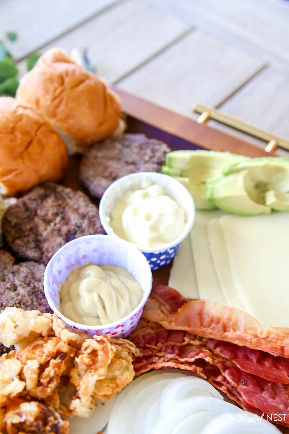 Make this epic summer hamburger charcuterie board with all these must-have ingredients. #ABlissfulNest #charcuterieboard #summerrecipe #summerfood