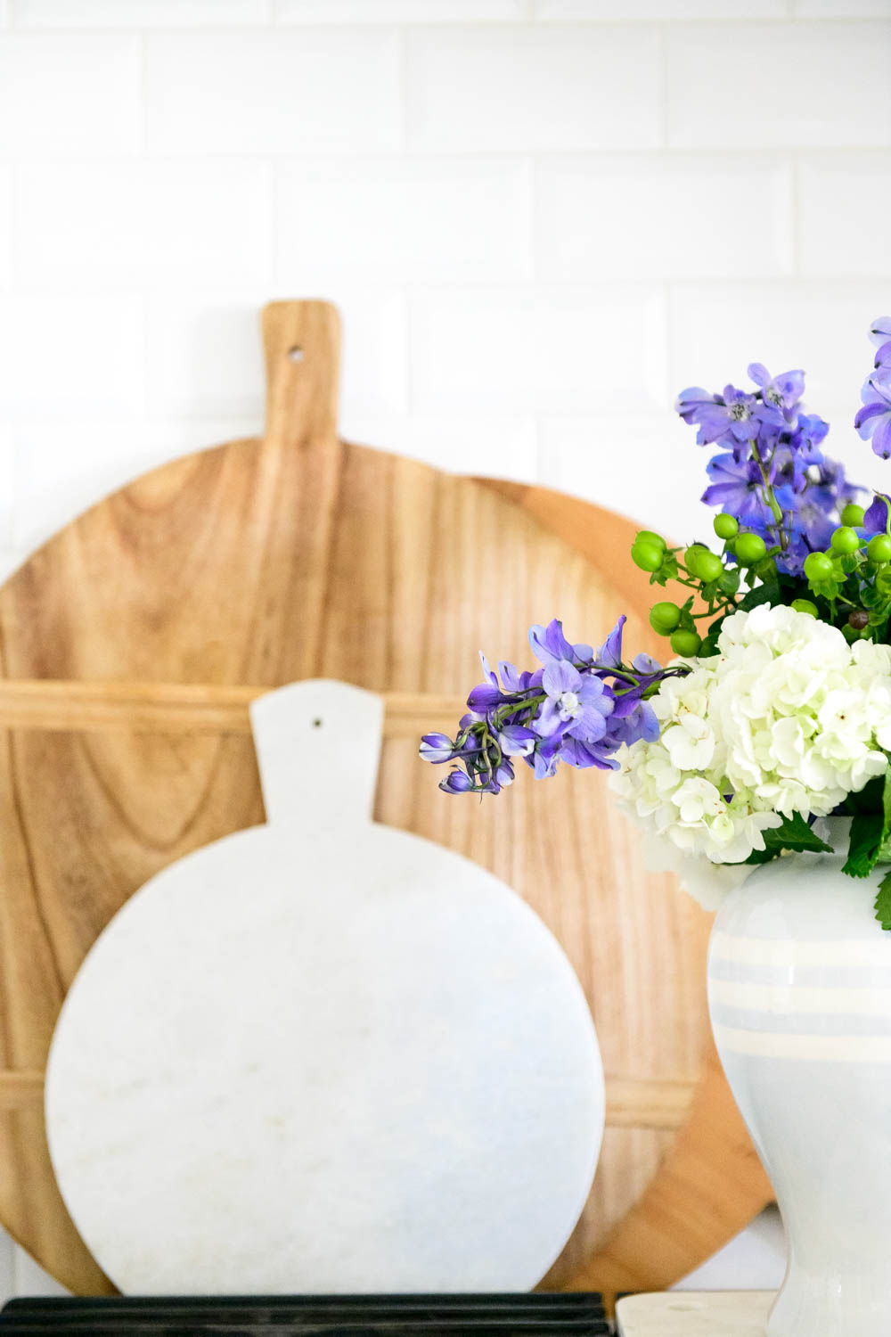 Grocery store flowers, cooktop, kitchen stove, blue and white gingham. #ABlissfulNest #whitekicthen #kitchendecor #kitchenstyle