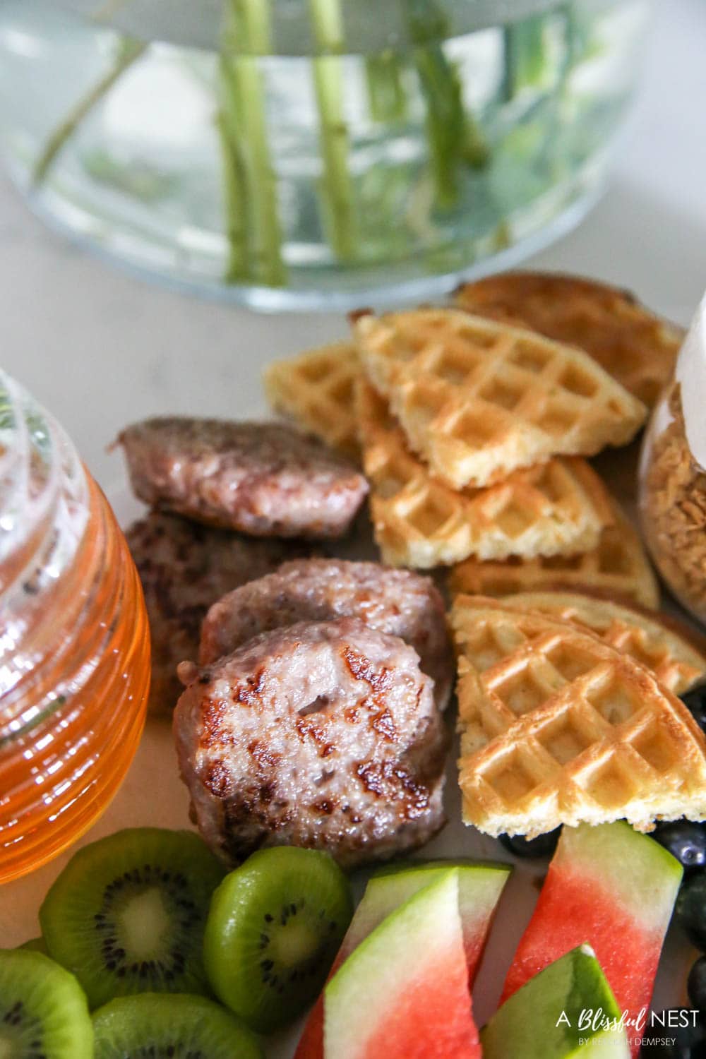 Make a brunch charcuterie board with all these breakfast items for your family on the weekends or for a girls brunch with friends. #ABlissfulNest #charcuterieboard #brunchrecipes #breakfastrecipes