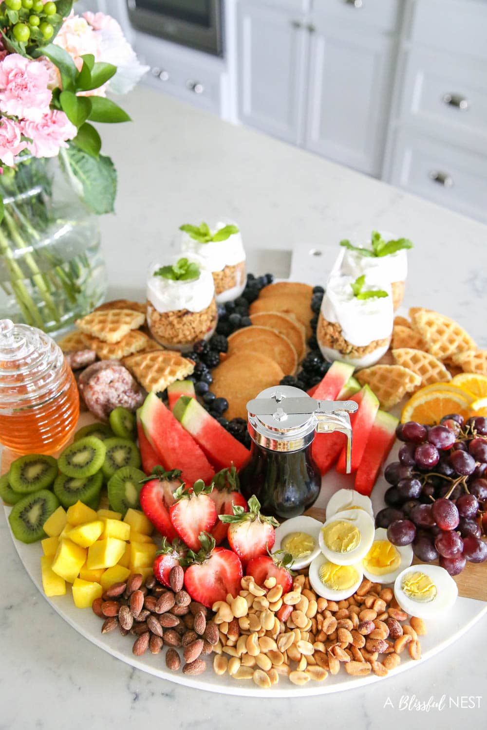 Make a brunch charcuterie board with all these breakfast items for your family on the weekends or for a girls brunch with friends. #ABlissfulNest #charcuterieboard #brunchrecipes #breakfastrecipes