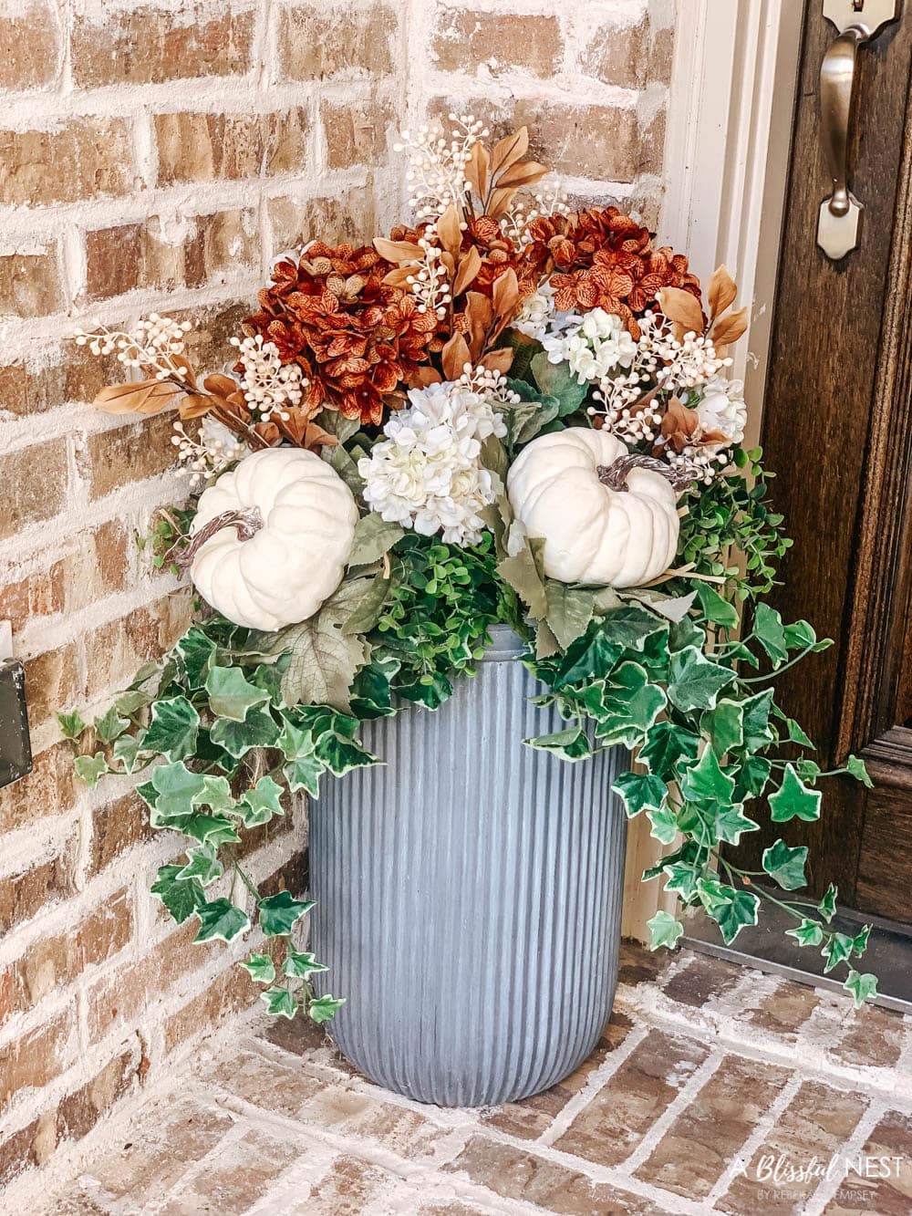 A small fall porch makeover with affordable finds from pumpkins, lanterns, fall wreath, and more. #ABlissfulNest #HobbyLobby #HobbyLobbyFinds #ad #fallporch #falldecor