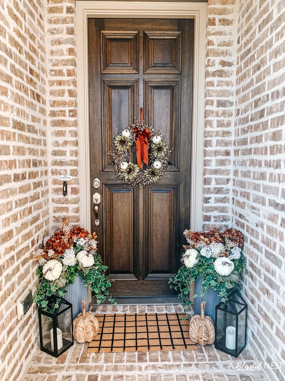 A small fall porch makeover with affordable finds from pumpkins, lanterns, fall wreath, and more. #ABlissfulNest #HobbyLobby #HobbyLobbyFinds #ad #fallporch #falldecor