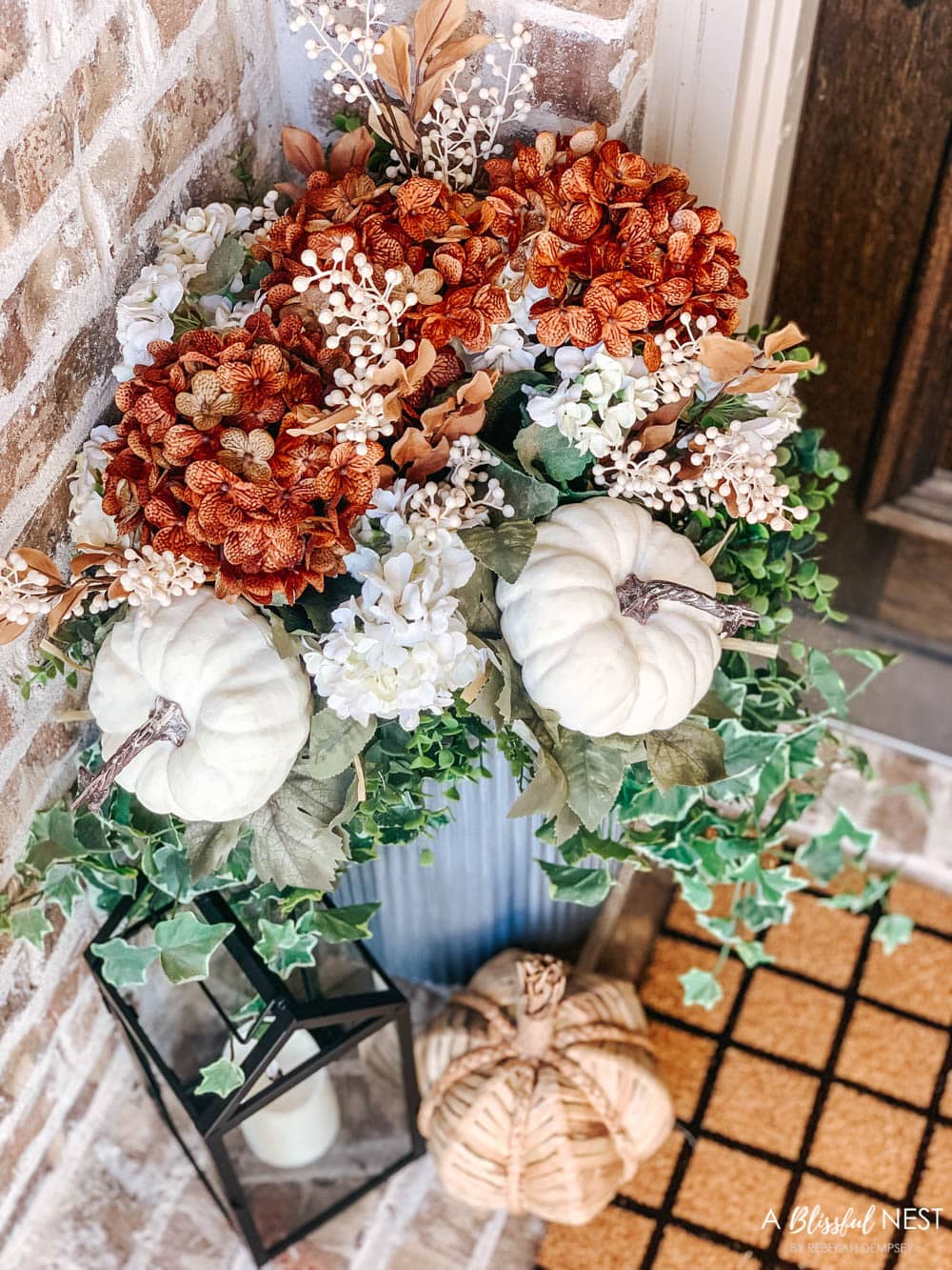 A small fall porch makeover with affordable finds from pumpkins, lanterns, fall wreath, and more. #ABlissfulNest #HobbyLobby #HobbyLobbyFinds #ad #fallporch #falldecor