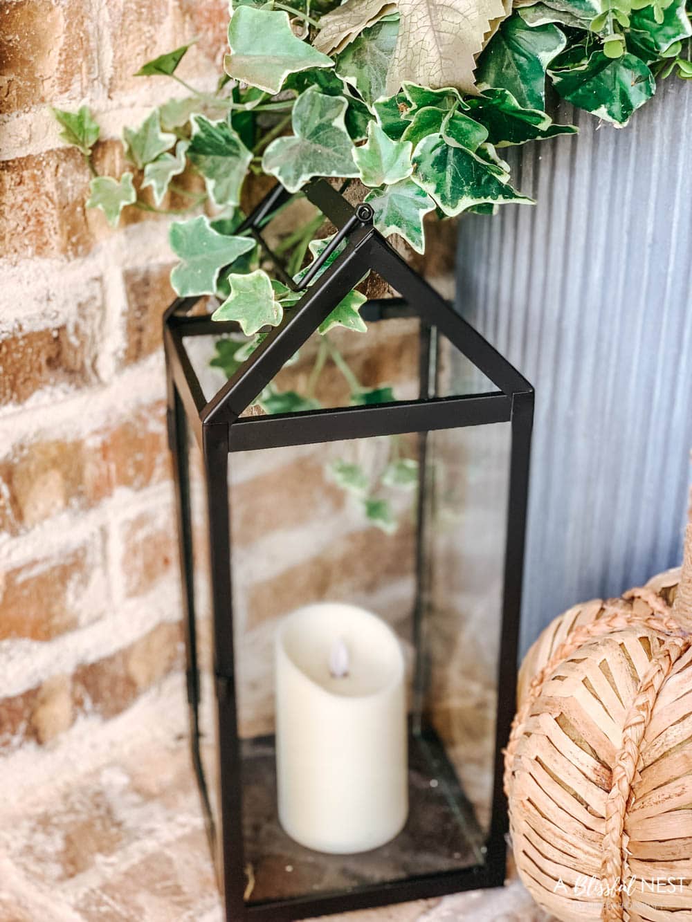 A small fall porch makeover with affordable finds from pumpkins, lanterns, fall wreath, and more. #ABlissfulNest #HobbyLobby #HobbyLobbyFinds #ad #fallporch #falldecor