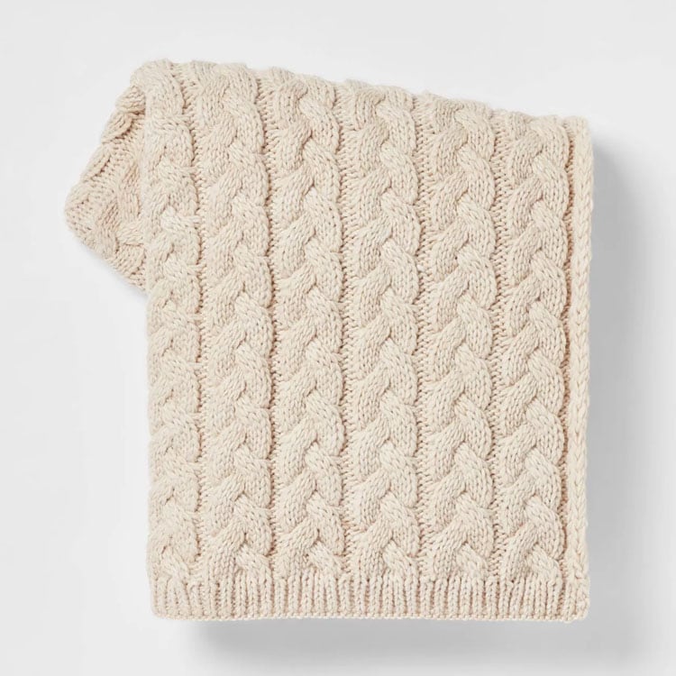 This cable knit throw blanket is affordable, comes in so many colors and is a must have for fall! #ABlissfulNest