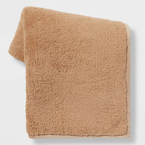 This cozy, $15 sherpa throw blanket is a perfect hostess gift idea! #ABlissfulNest