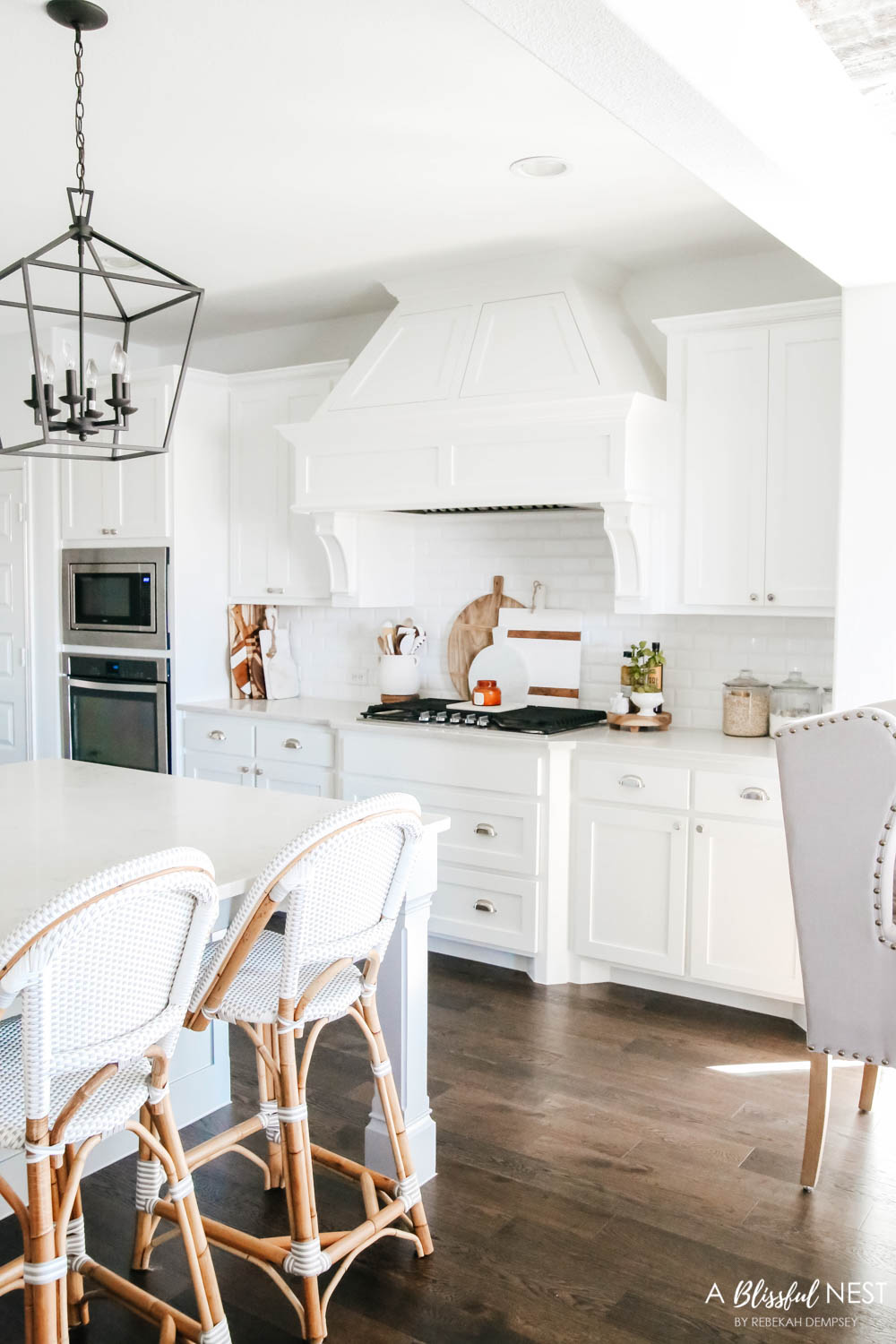 Beautiful fall decor details in this kitchen with burgundy eucalyptus leaves, delicious fall candles, Serena and Lily barstools. #ABlissfulNest #fallkitchen #falldecor #fallideas