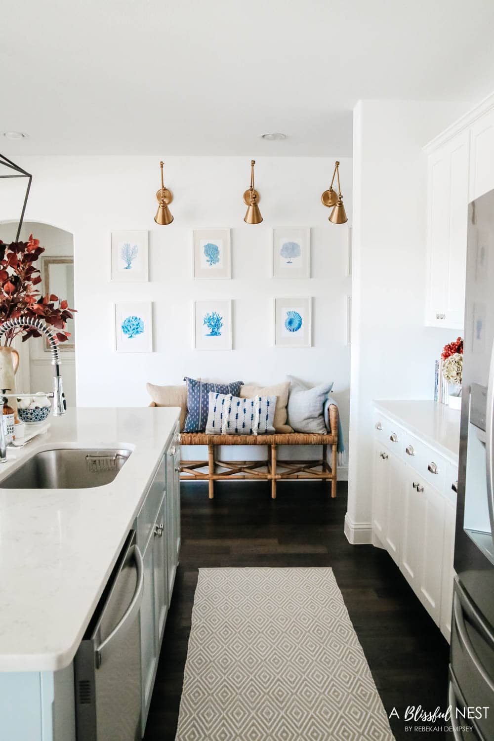 Beautiful fall decor details in this kitchen with burgundy eucalyptus leaves, delicious fall candles, Serena and Lily barstools. #ABlissfulNest #fallkitchen #falldecor #fallideas