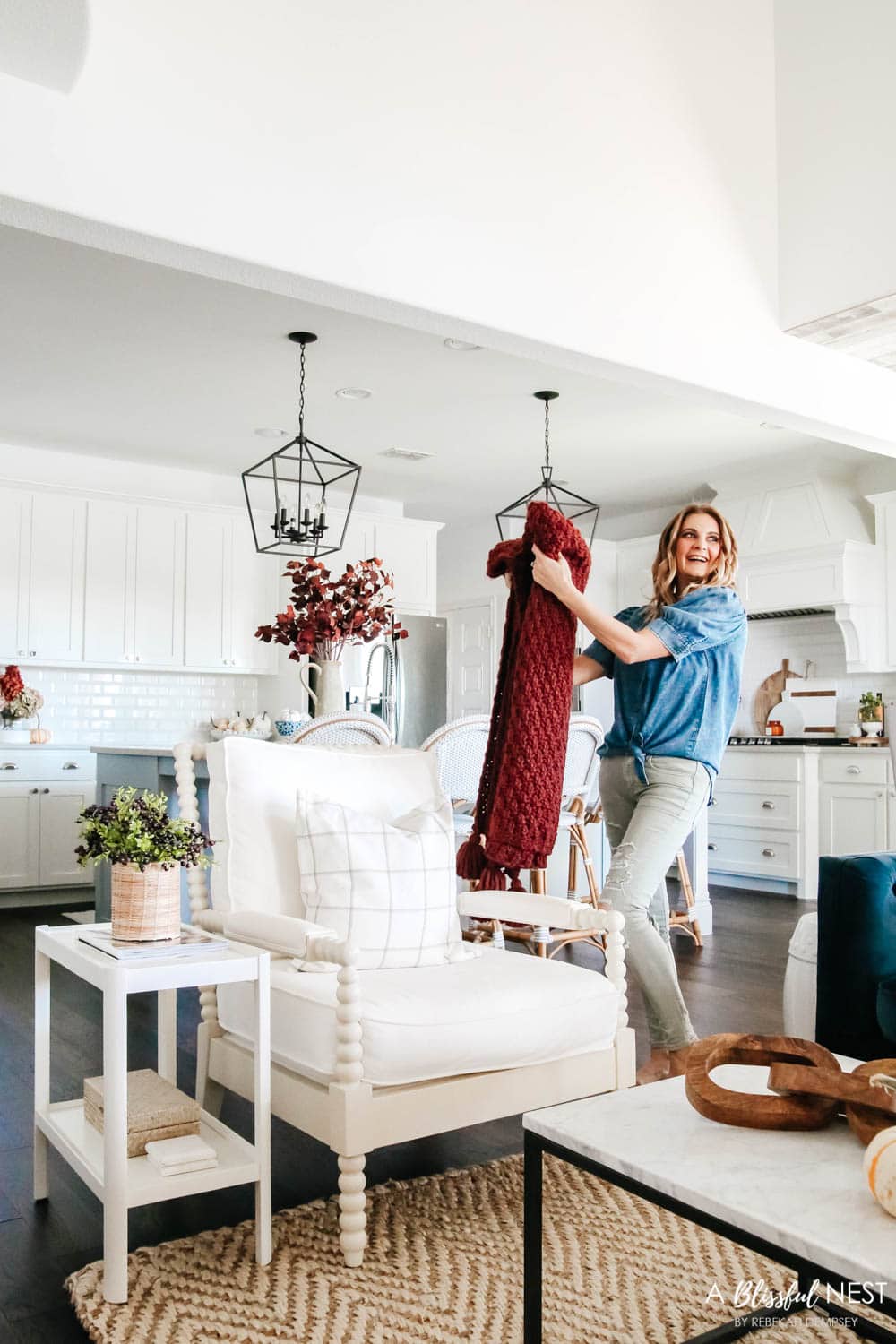 Cozy pillows, plush blankets, fall florals, fall decor. #ABlissfulNest #falldecor #falllivingroom