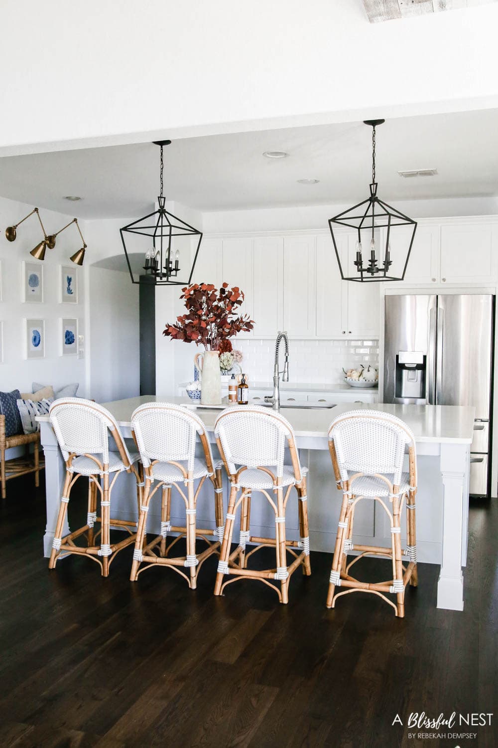 Beautiful fall decor details in this kitchen with burgundy eucalyptus leaves, delicious fall candles, Serena and Lily barstools. #ABlissfulNest #fallkitchen #falldecor #fallideas