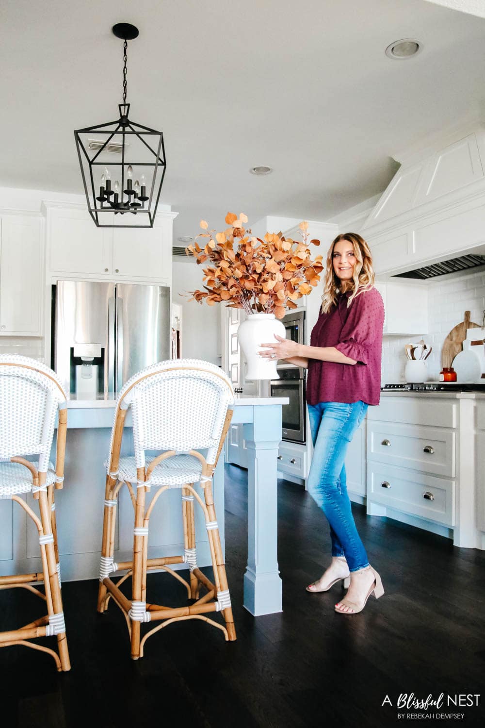 Beautiful fall decor details in this kitchen with burgundy eucalyptus leaves, delicious fall candles, Serena and Lily barstools. #ABlissfulNest #fallkitchen #falldecor #fallideas