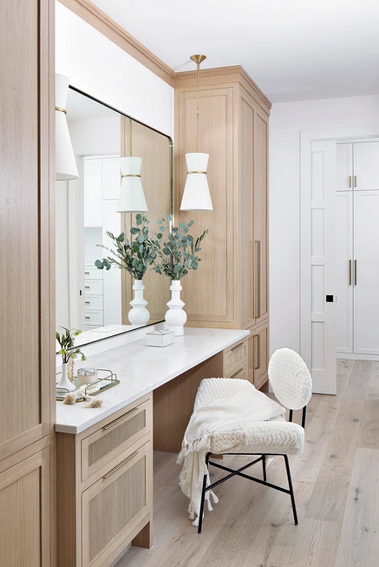 This natural wood vanity in a home designed by HW Interiors is such a pretty space!