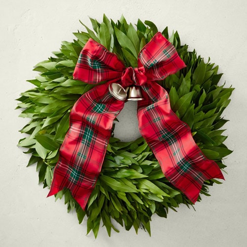 This greenery wreath has the most beautiful tartan ribbon and gold bell detail to it! #ABlissfulNest
