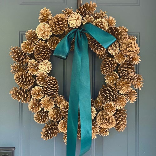 This gold pinecone wreath is so different yet beautiful for the holiday season! #ABlissfulNest