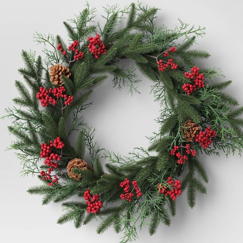 This pine and red berry wreath is so pretty and under $50! #ABlissfulNest