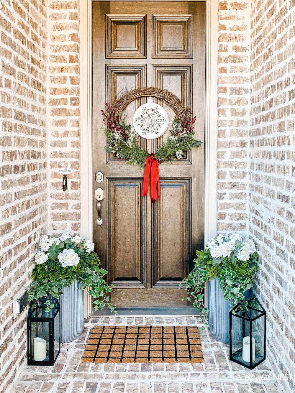 Step-by-step instructions to making this simple Christmas grapevine wreath for the holidays. #ABlissfulNest #HobbyLobby #sponsor #Christmaswreath