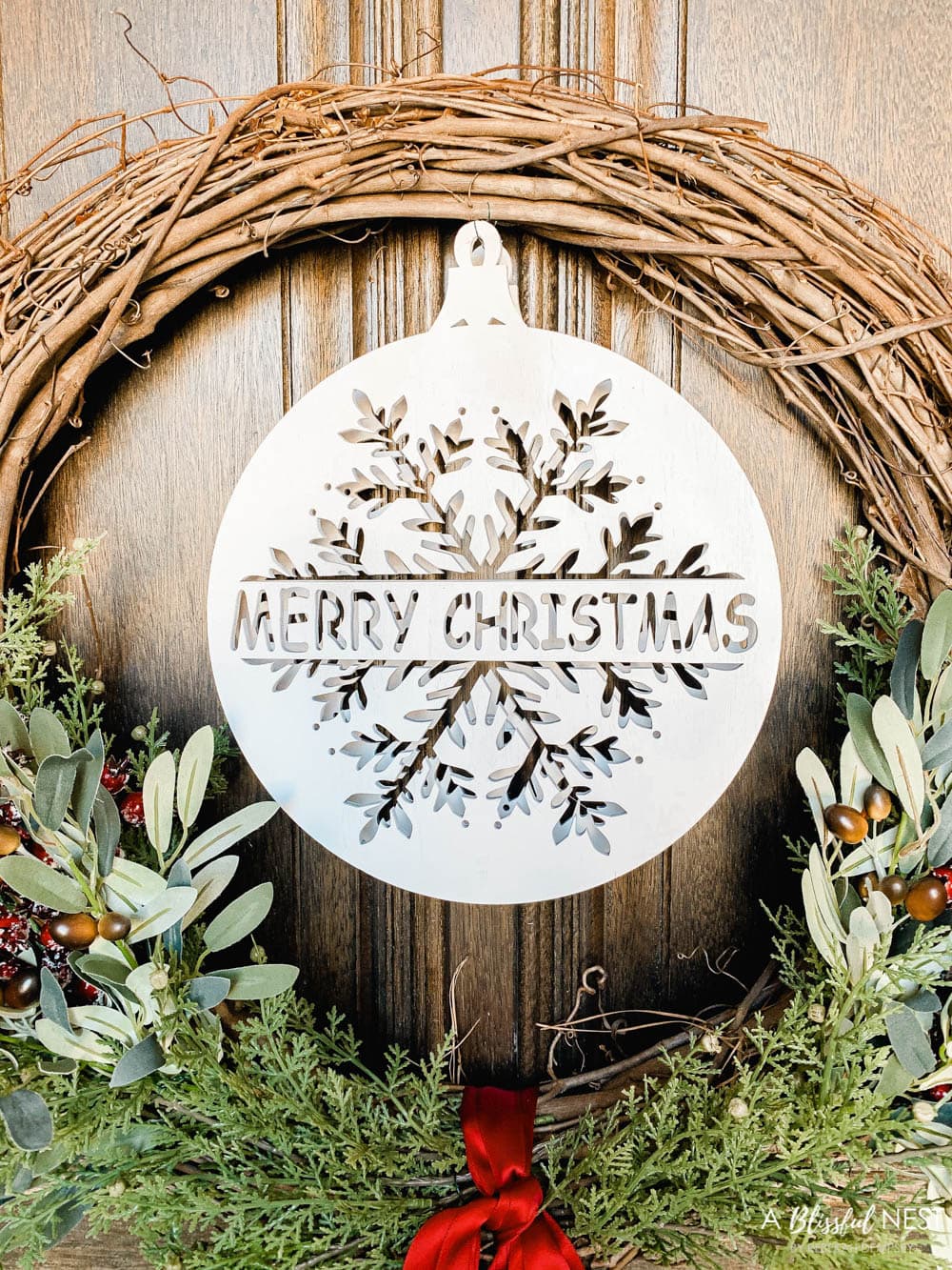 Step-by-step instructions to making this simple Christmas grapevine wreath for the holidays. #ABlissfulNest #HobbyLobby #sponsor #Christmaswreath