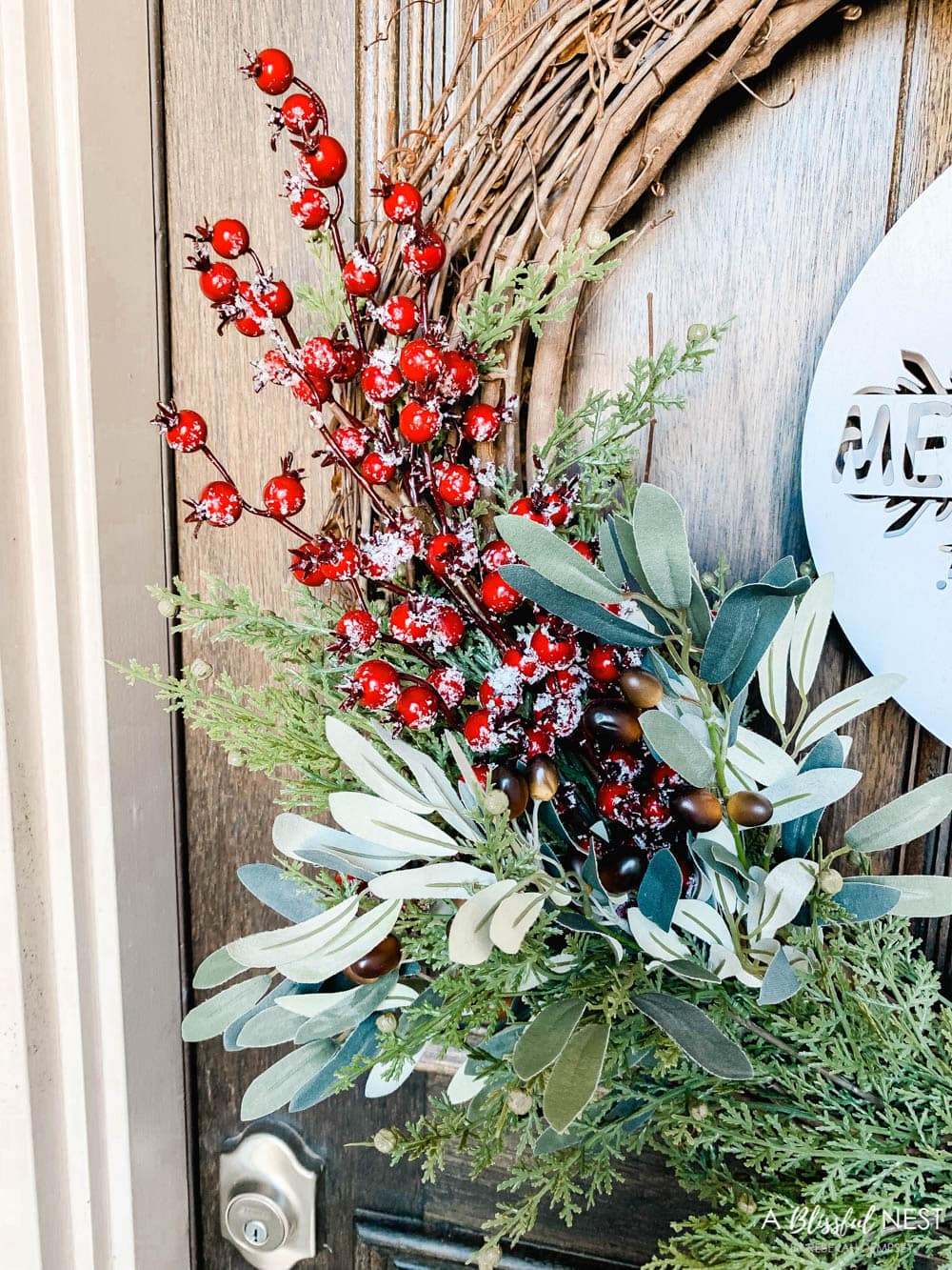 Step-by-step instructions to making this simple Christmas grapevine wreath for the holidays. #ABlissfulNest #HobbyLobby #sponsor #Christmaswreath