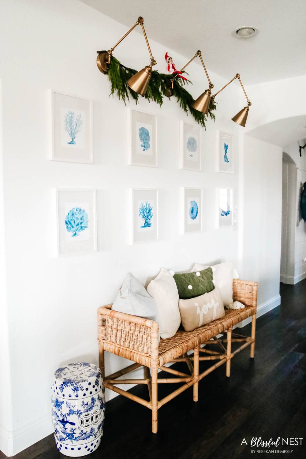 Neutral pillows on a rattan bench